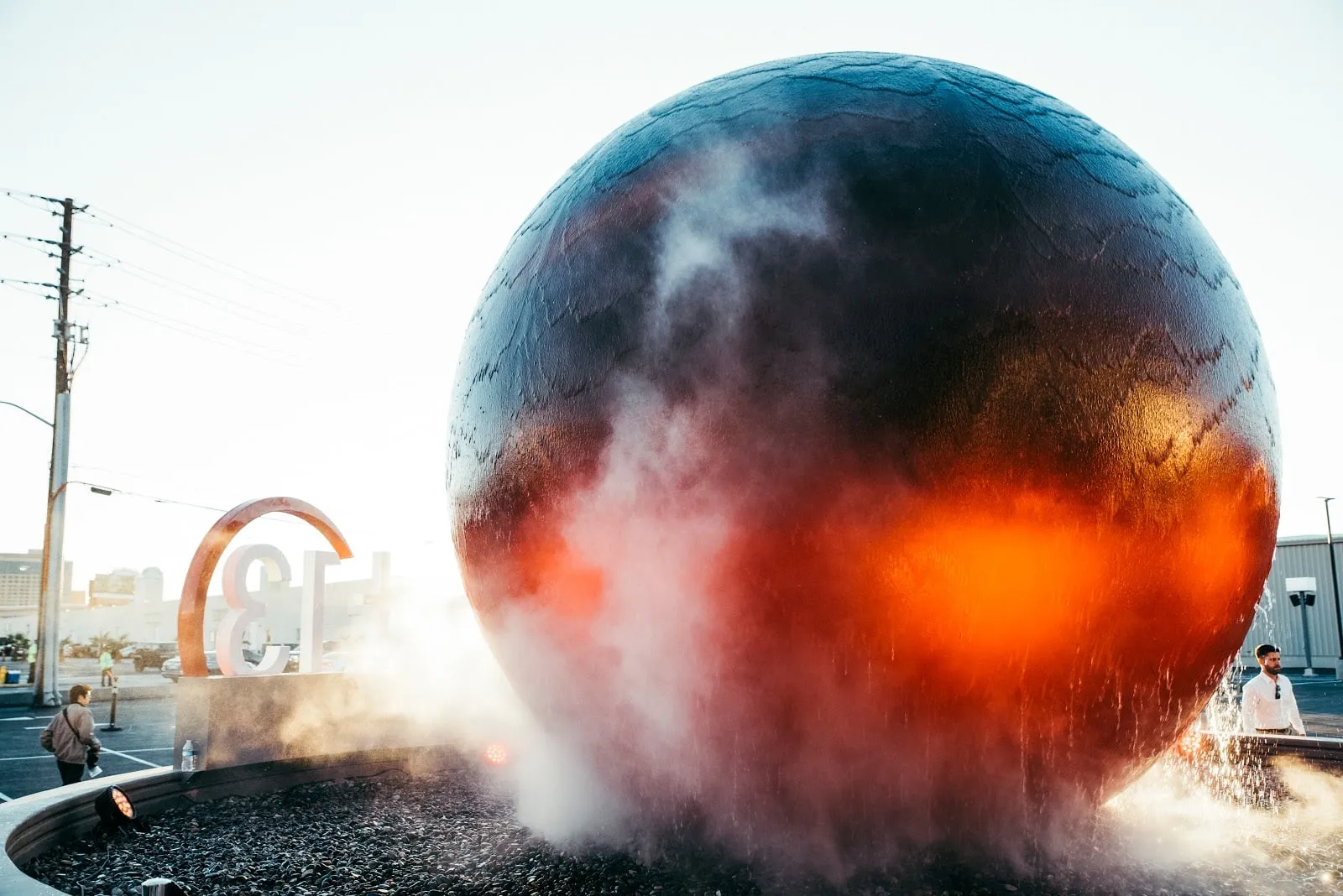 The sphere fountain outside the entrance, misting