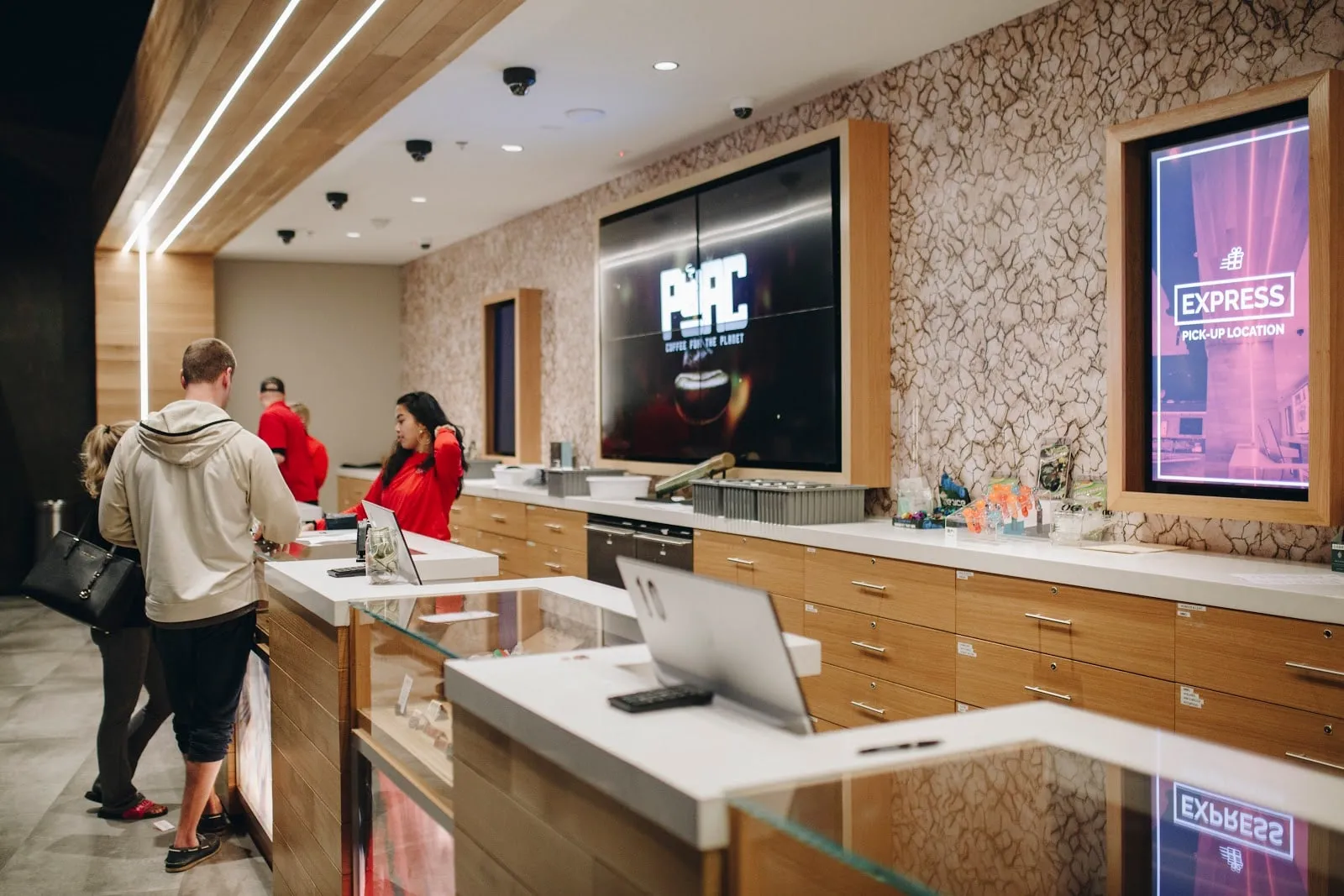 Shoppers at the registers beside the Express pickup screen