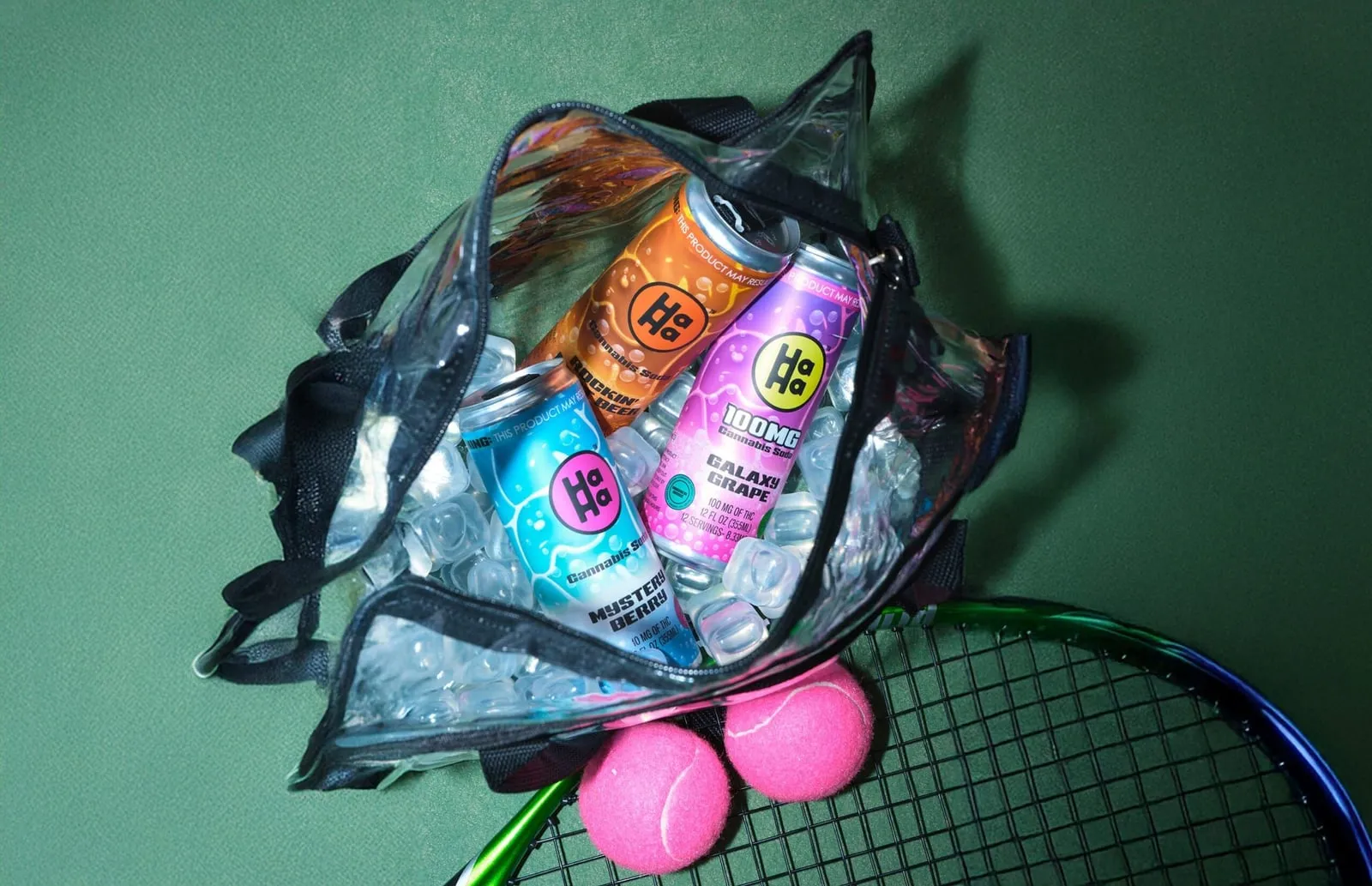 HaHa drinks on ice in a clear bag on a tennis racket