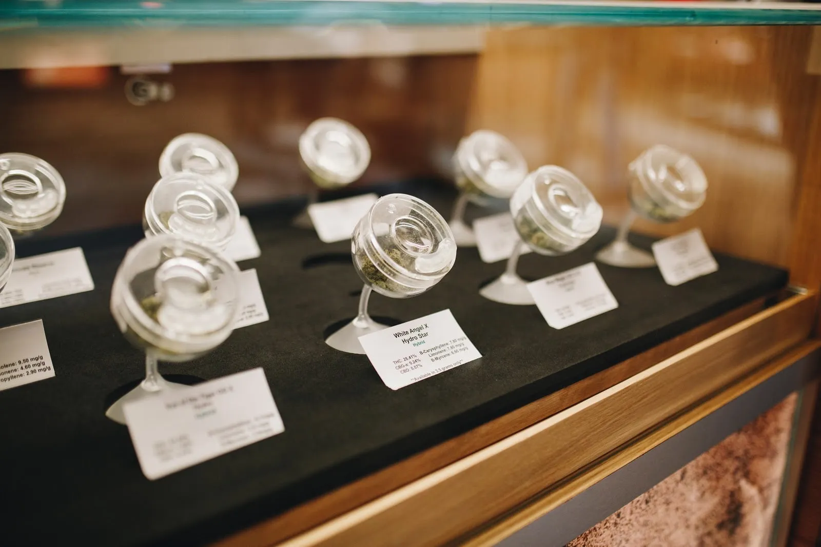 Flower in glass display jars, each with its label