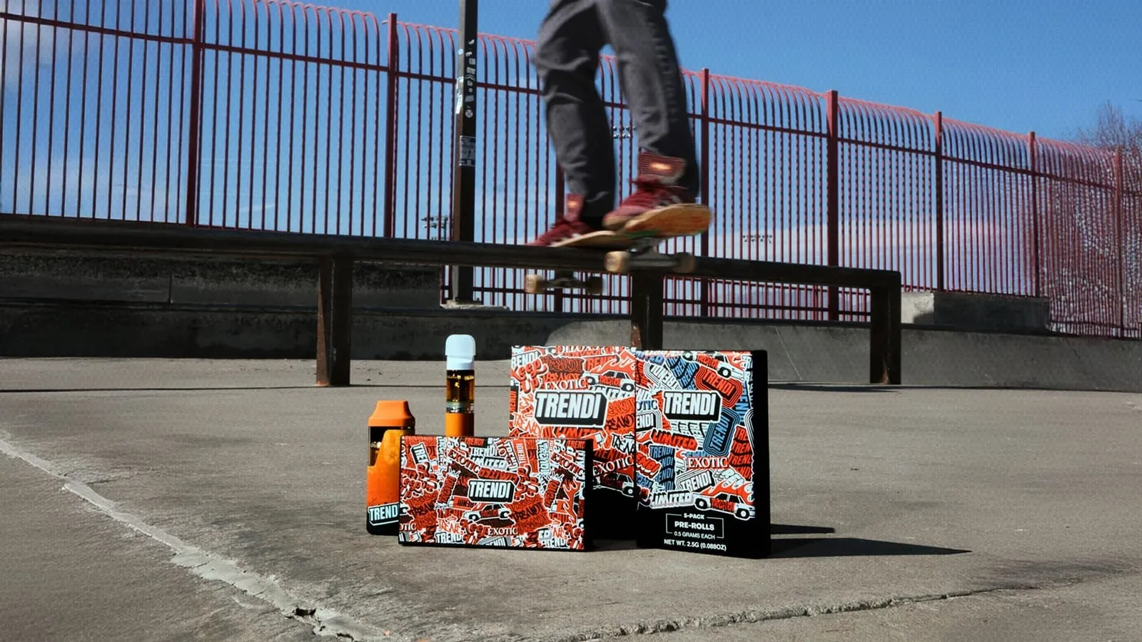 TRENDI pre-roll packs and a vape on a skatepark floor as a skater grinds a ledge behind them