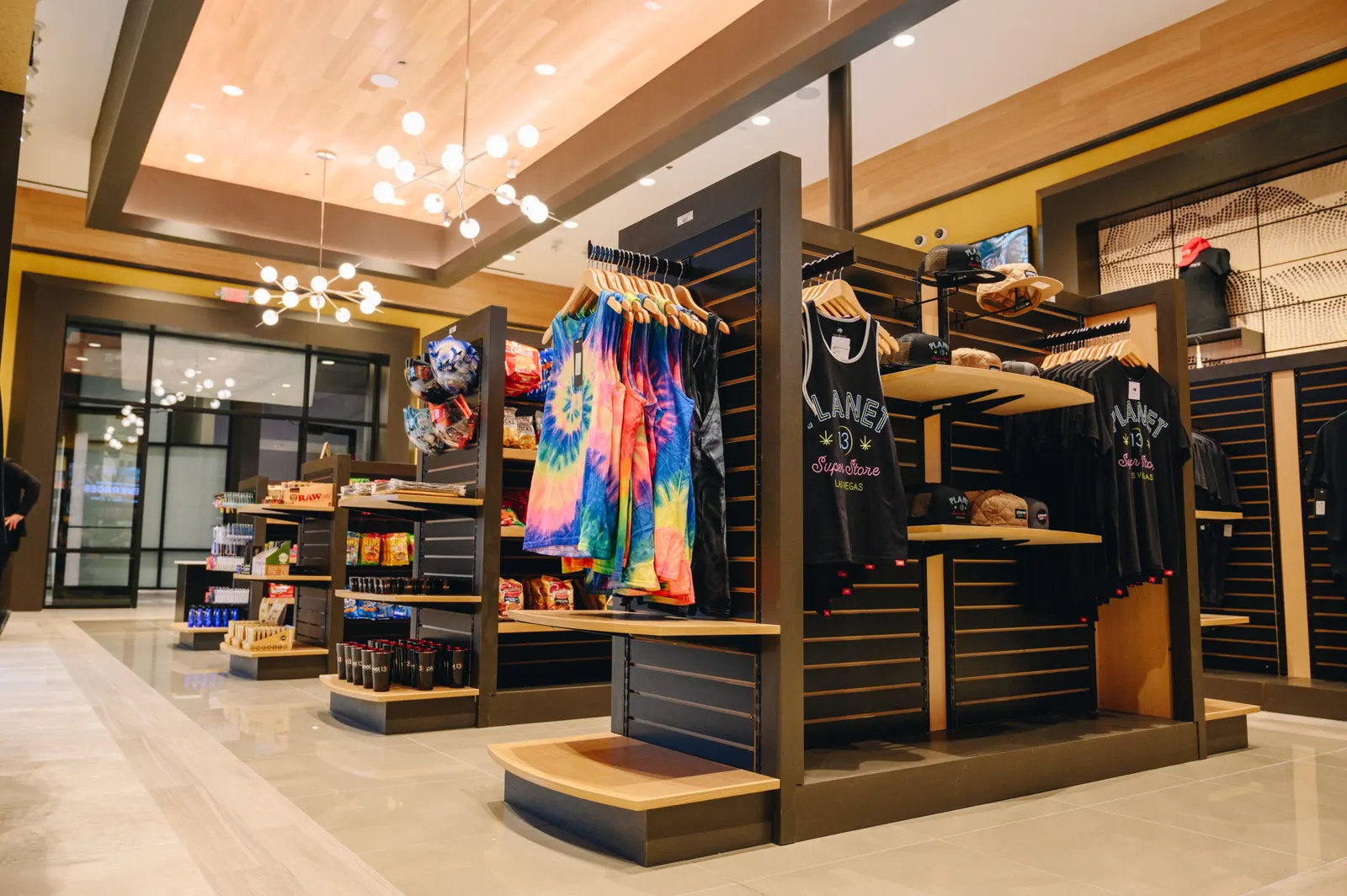 Planet 13 shirts and tie-dye on the racks at Stitched & Stuff